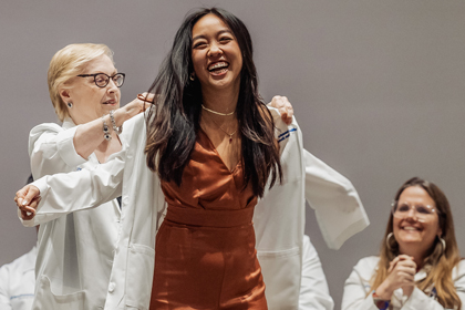 A woman recieving her whitecoat