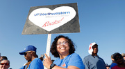 One walker carries her “UT Southwestern Rocks!” sign for all to see.