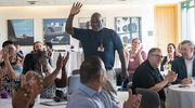 Gold PACT pin recipient and Software System Specialist Albert Garner is cheered on by his peers.
