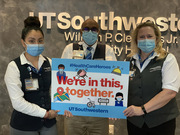 Staff in Guest and Patient Services show support for UTSW’s health care heroes. From left to right: Ximena Acevedo, Ibrahim Ali, and Allyson Hart