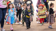 The costumed children head out for the Halloween candy pickup.