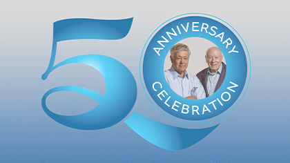 blue 50 year logo with Drs. Brown and Goldstein in the circle