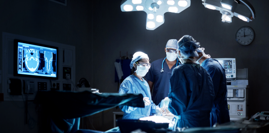 Doctors performing surgery in operating room.