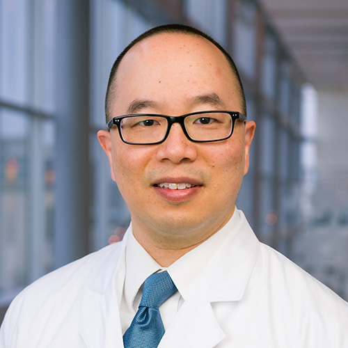 Dr. Liu, a smiling man with dark hair