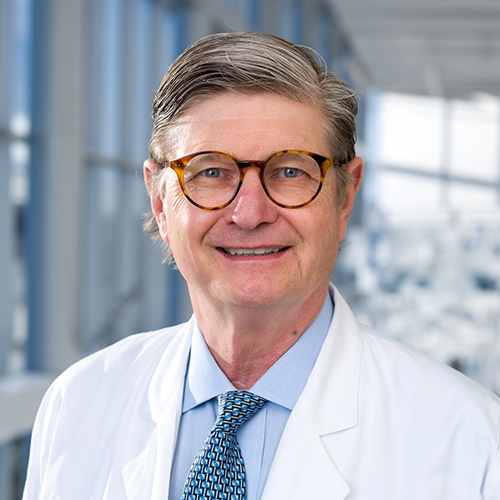 Dr. Wukich, a smiling man with gray hair and glasses