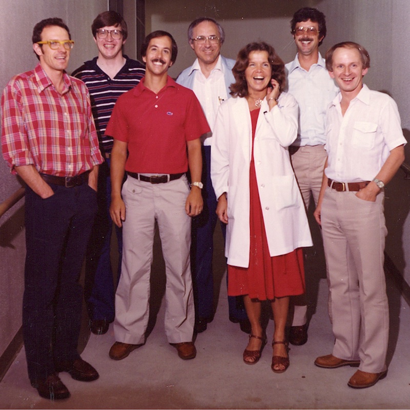 Dr. John Porter surrounded by five male fellows and one female fellow