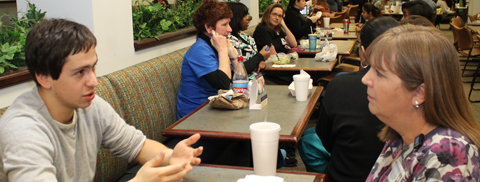 English Conversation Partners Yury Rapoport and Susan Thompson meet for lunch on South Campus.