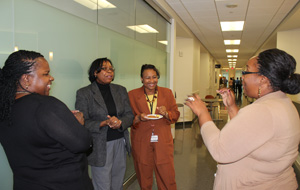 Layla Bushnell, Senior Administrative Associate, talks with colleagues at Neurology Open House.
