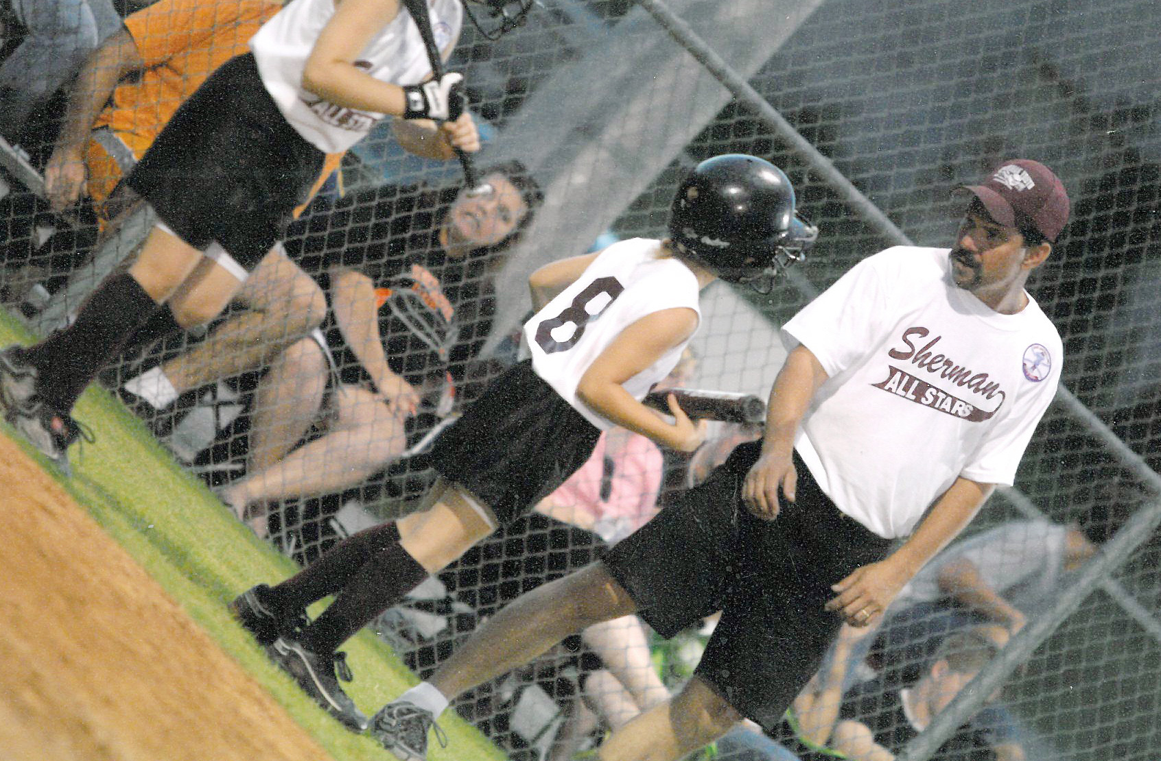 Thomas Pettit coaching softball