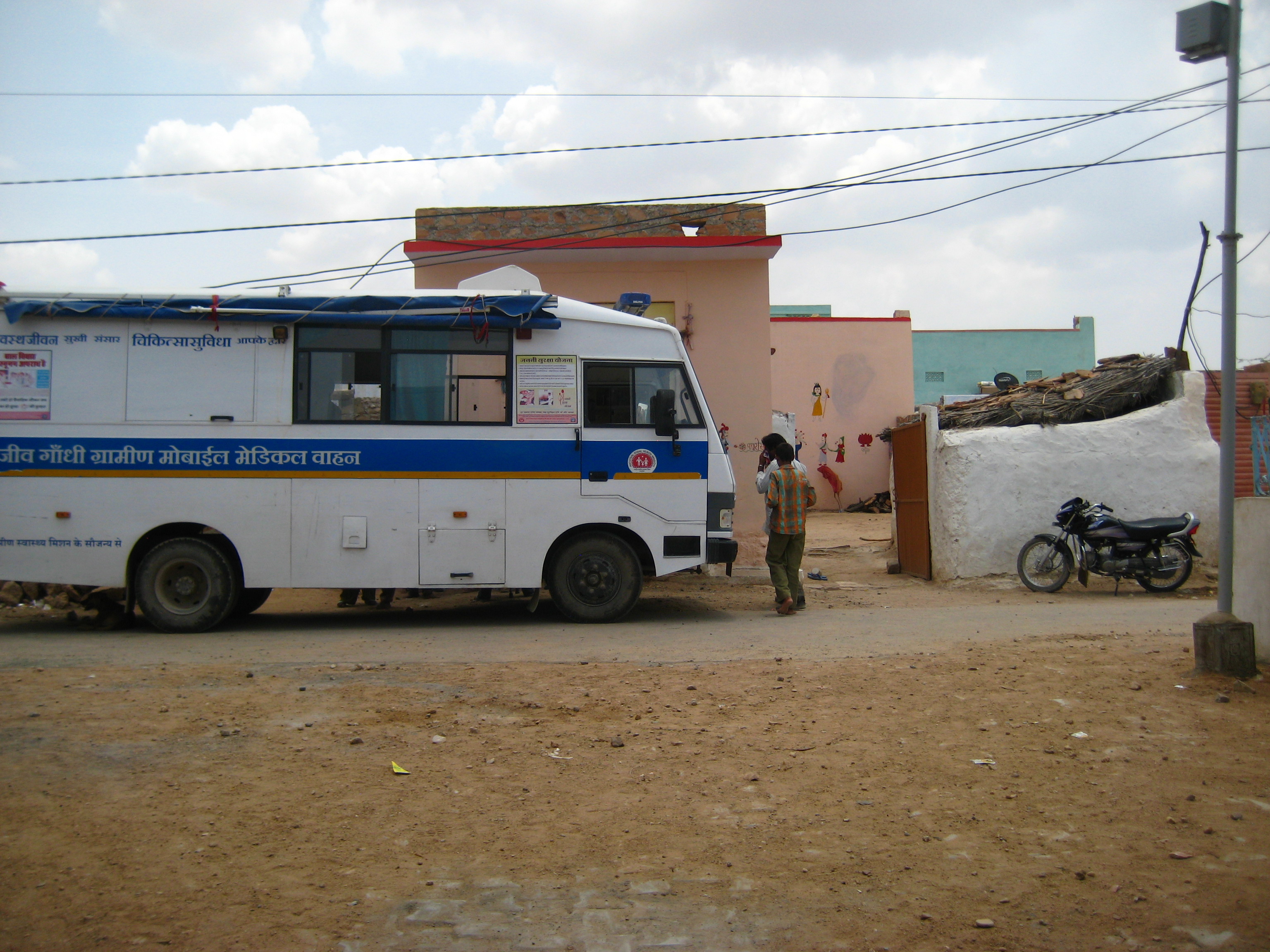 Mobile medical van on village street