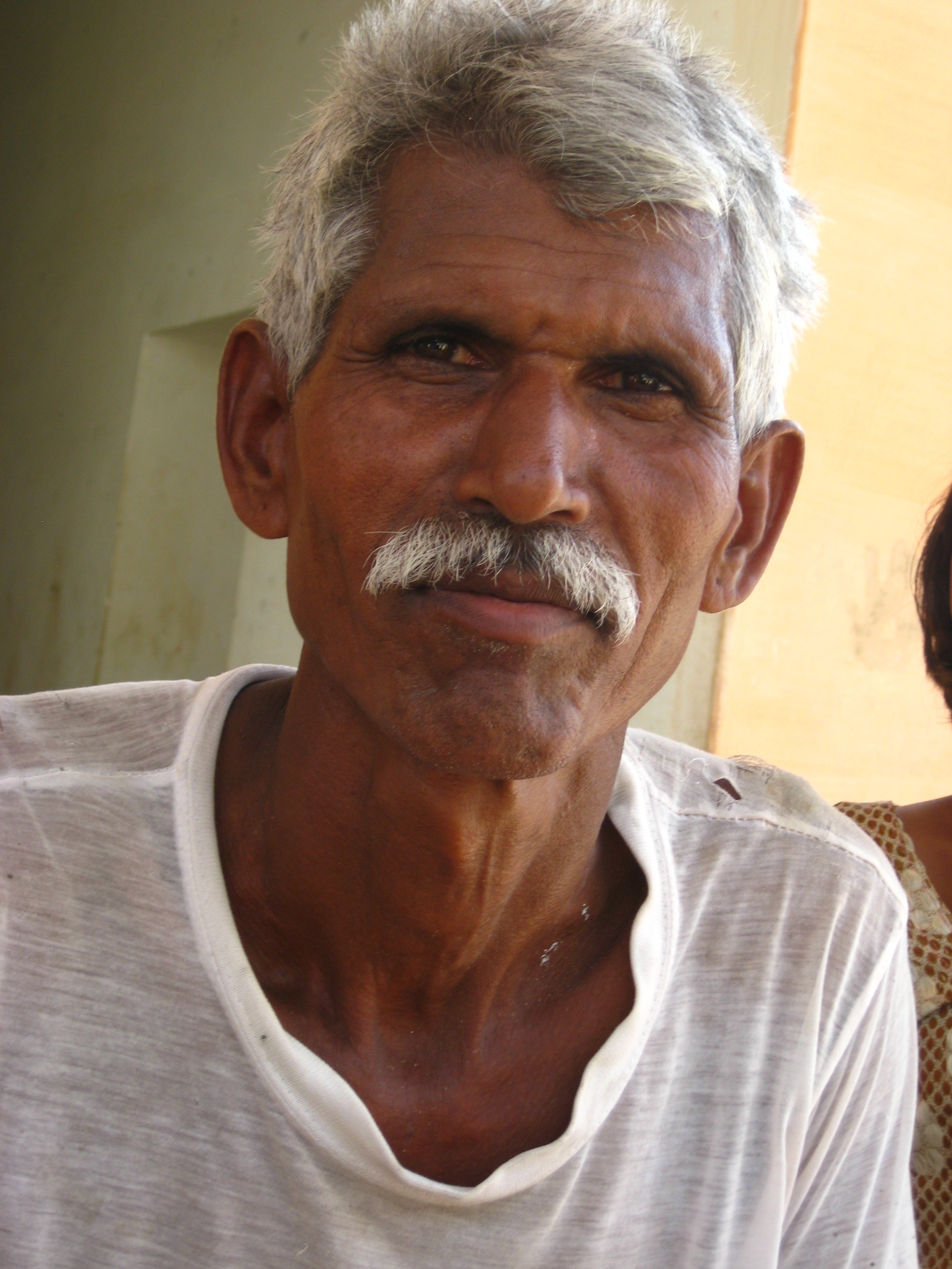 Older man in t-shirt with gray hair and mustache