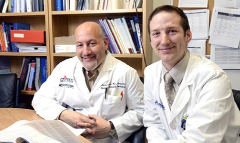 Dr. Glenn Flores (left) and medical student David Vermette are working to eliminate obstacles to health care access.