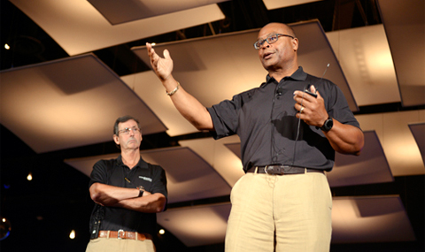 Former NFL coach and Hall of Fame linebacker Mike Singletary (right) makes a point with Dr. Hunt Batjer, Chairman of Neurological Surgery at UT Southwestern.