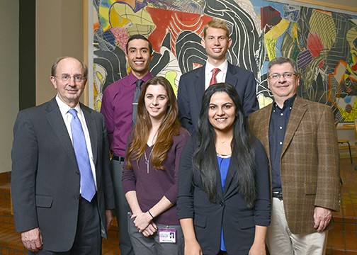 Drs. Michael Choti and Rene Galindo (left, right) joined Medical Student Research Forum presentation winners Barbara Burton, Zehra Farzal (front row, L to R), Erik Contreras, and Scott Carlson (back row, L to R) following the January program.