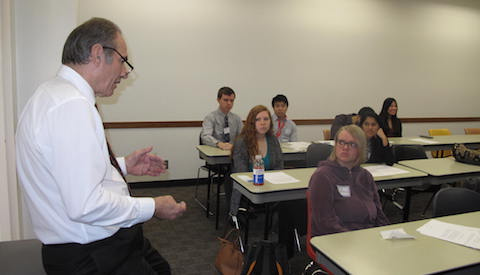 Dr. Gerald Casenave, Associate Professor of Rehabilitation Counseling, discusses the Convergence case study with one of the 70 small groups that took part in the annual event at UT Southwestern Medical Center.