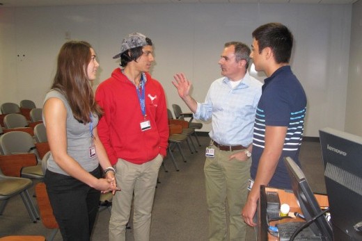 Dr. Ralph DeBerardinis (second from right) talks with SURF students