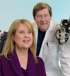 Dr. Wayne Bowman, right, performed corneal transplants on Patti Diou.