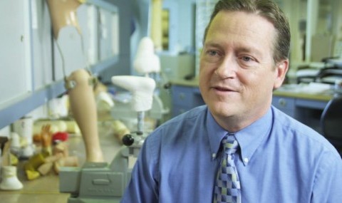 Man in prosthetics lab.