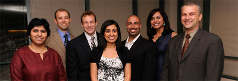 Dr. Shilpa Chitnis and Dr. Steven Vernino stand with group of graduates