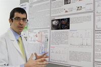 Isaac Marin-Valencia with his brain tumor research poster