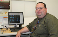 Dr. Joseph Vaughan at desk