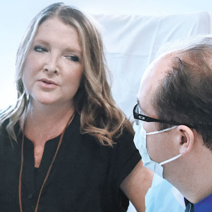 Heart-liver transplant recipient Andrea Joyner has a follow-up checkup with Dr. Malcolm MacConmara