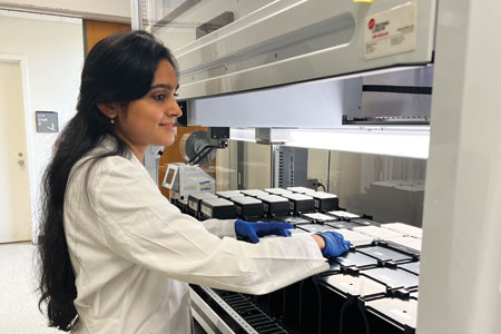 HTS Core screening scientist Shweta Murali prepares the deck of the Beckman i7 for a high-throughput screening experiment