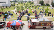 It was a sunny day at UTSW as attendees lined up for complimentary roasted corn or to order lunch from food trucks.