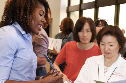 group of diverse medical students gather