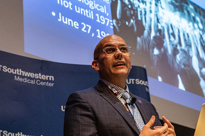 A man speaking at an event