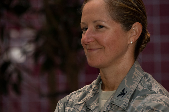 Female veteran with brown hair, wearing her service uniform
