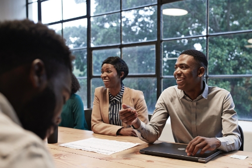 A man and a woman at a conference table