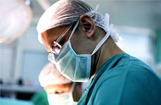 Side profile of a surgeon wearing a surgical mask