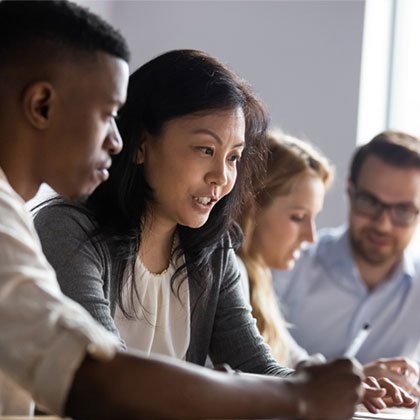 diverse group of 4 people study together