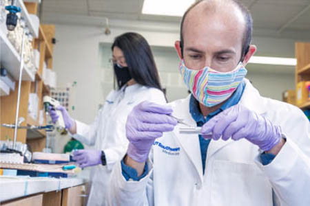 Dr. Ryan Hibbs conducts research in his lab