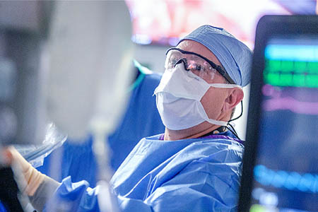 A man wearing protective eyewear and mask