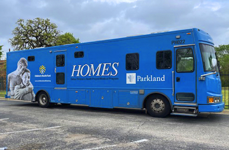 A large blue mobile care unit for women's health from Parkland