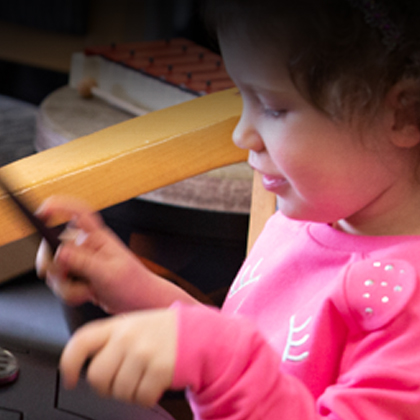 A little girl playing in classroom