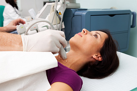 A woman getting a checkup by the doctor