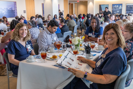 UTSW employees passing out food bags at the HealthFest