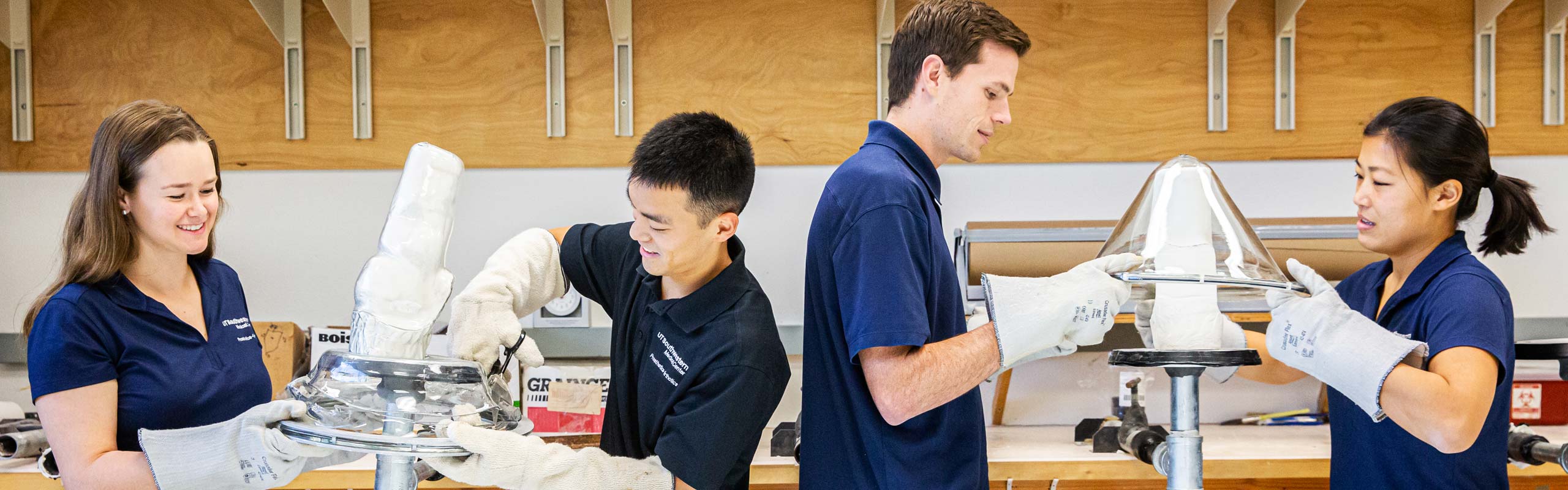 People in scrubs working on equipment