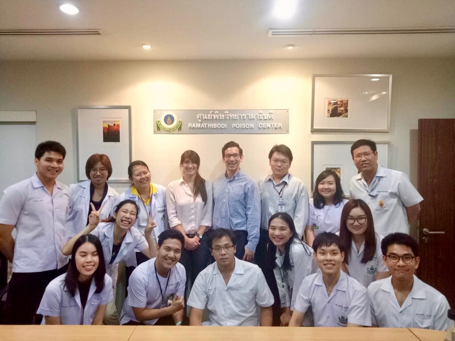 Group photo of Taylore King and Christian Davidson with Thai physicians and medical students at the Ramathibodi Poison Center