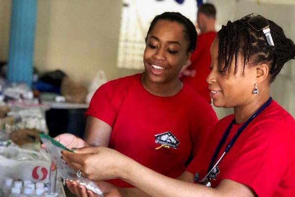 Cayenne Price helps sort medication in a temporary clinic in the Dominican Republic