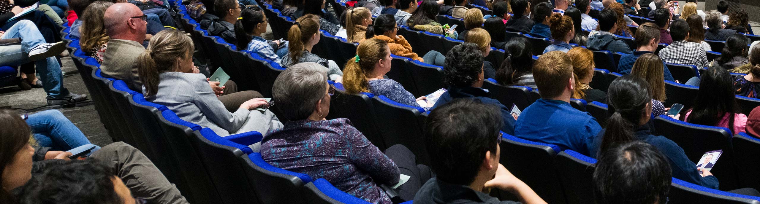 A group of people sitting in a seminar