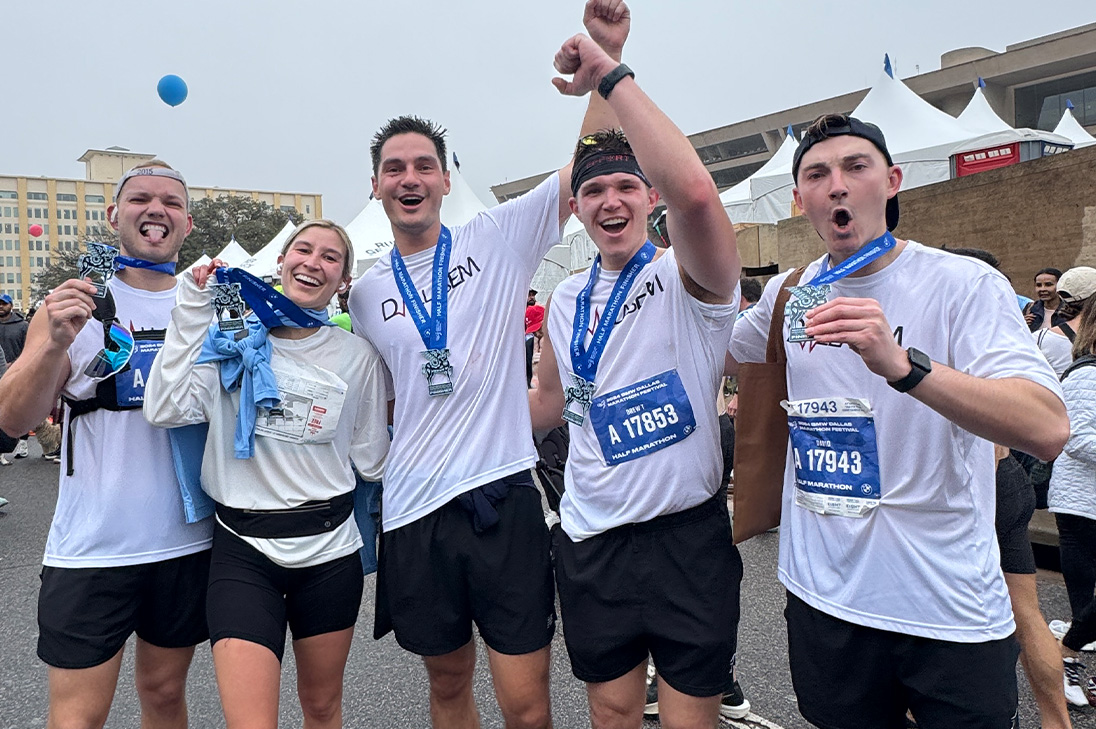 Our doctors celebrating and holding up medals after race.