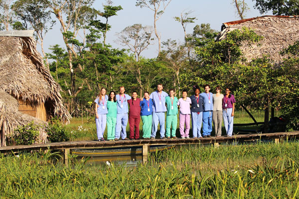Students standing on a small bridge in rural Guatemala