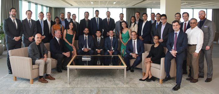Group of people in formal wear smiling