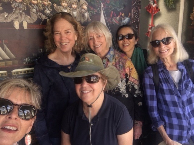 6 women smile in a group on a Faculty Women's Club outing with the Garden Exchange
