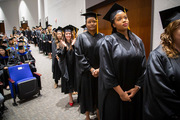 Graduates line up to receive their diplomas.
