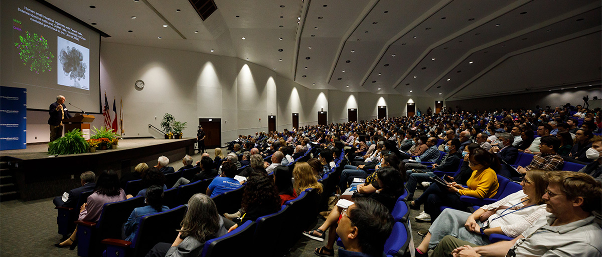 audience members watching symposium